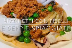 Spaghetti con piselli e seppie spiaggiate