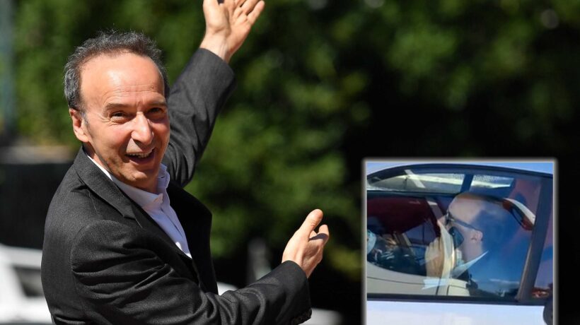 Benigni in auto al telefono e senza cinture allacciate. Solo per lui la vita è bella…