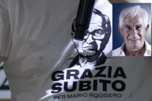 Maglietta con il volto di Mario Roggero e montaggio con Giuseppe Di Gregorio