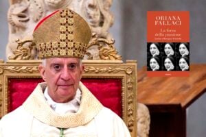 Rino Fisichella con la copertina del libro La forza della passione